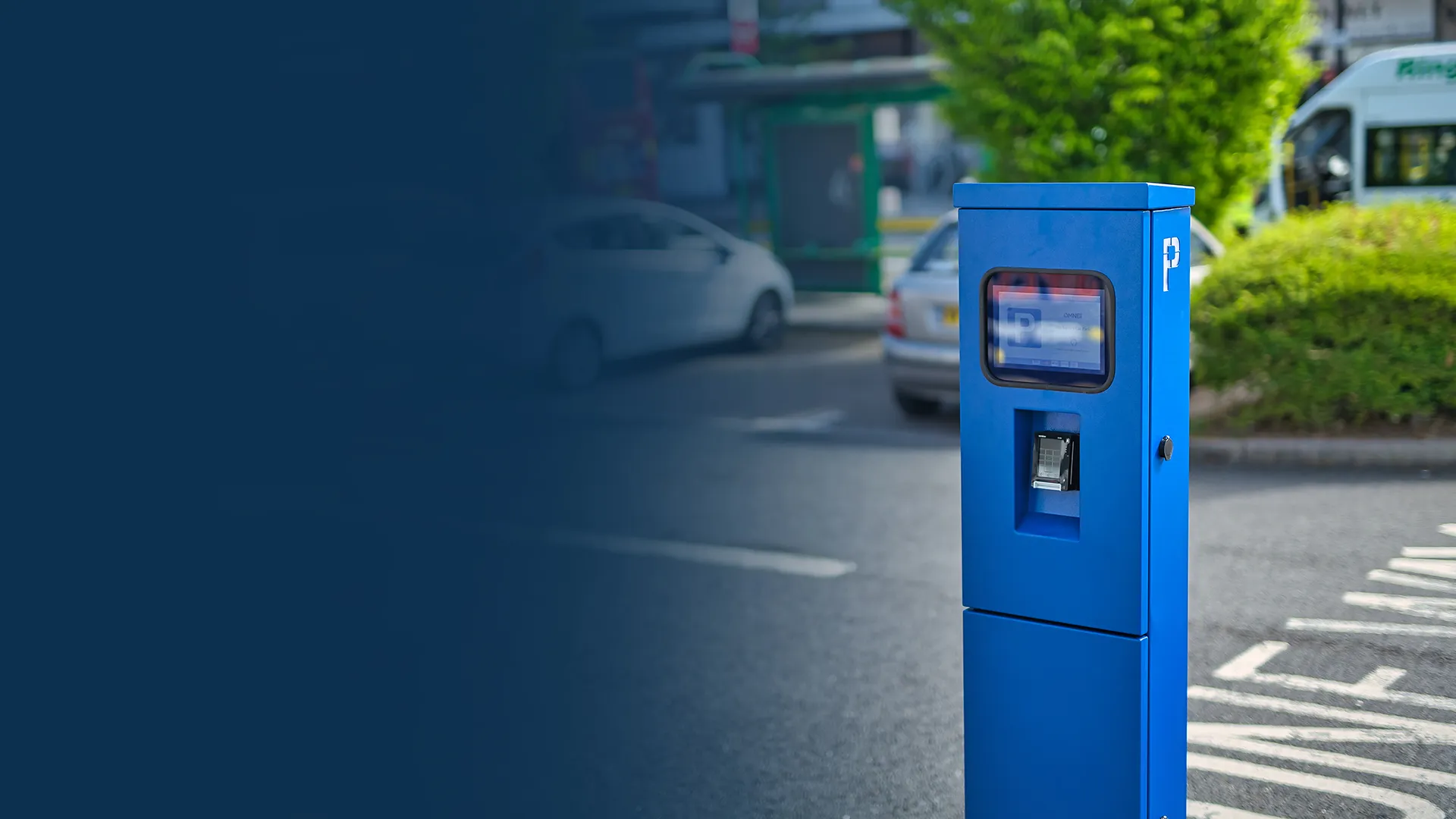 Motorist using a self-service parking payment machine in a car park